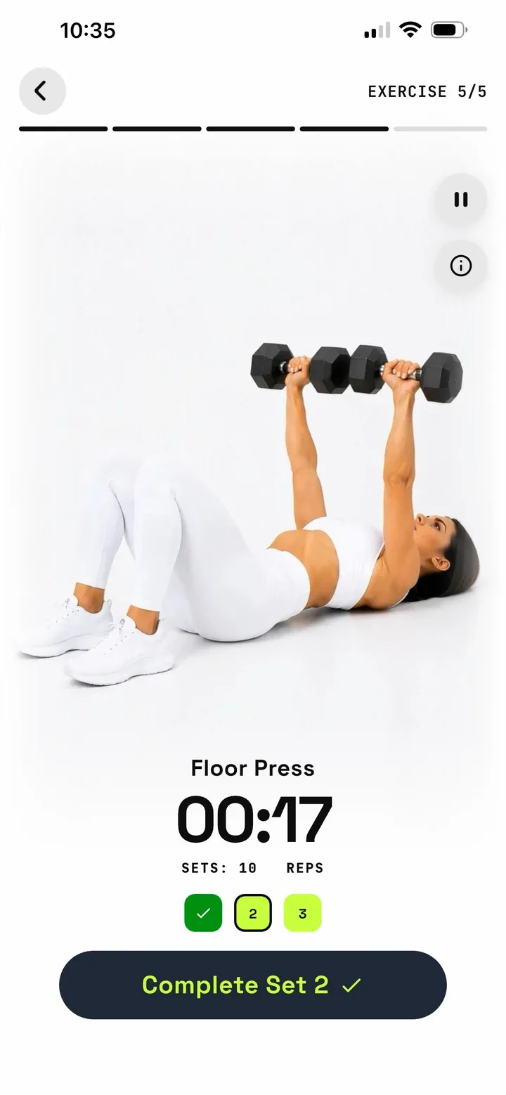 Guided floor press exercise with timer and set tracker